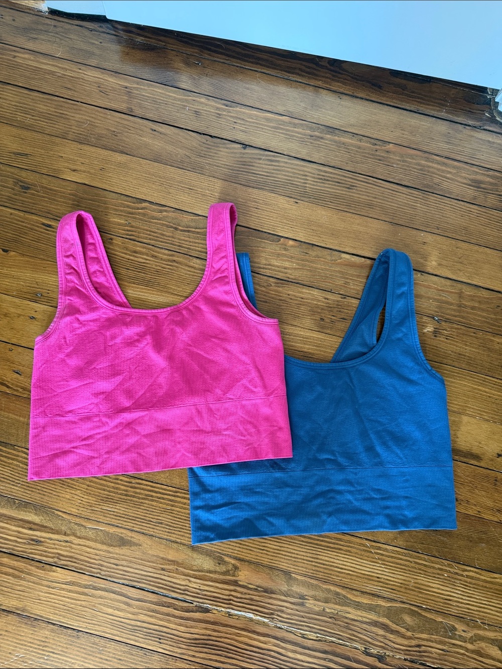 Two Athleta sports bras